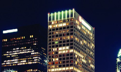 Lit-up high-rise buildings.