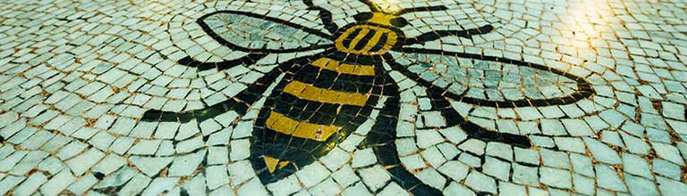 Manchester bee logo on tiles