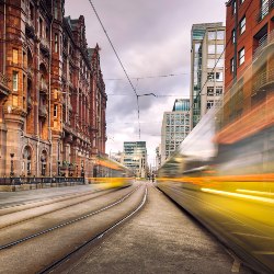 A tram going through Manchester City Centre.