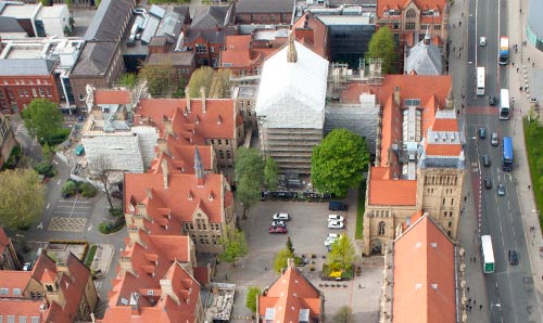 Aerial shot of building under wraps while conservation work takes place