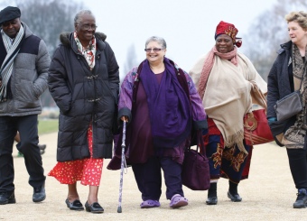 Group of elderly people walking in park